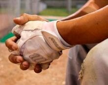 Baseball player sittnig on the bench Baseball all-star shift puts spotlight on Colorado’s exceptional voting laws